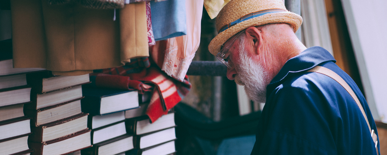 Elderly man buying books