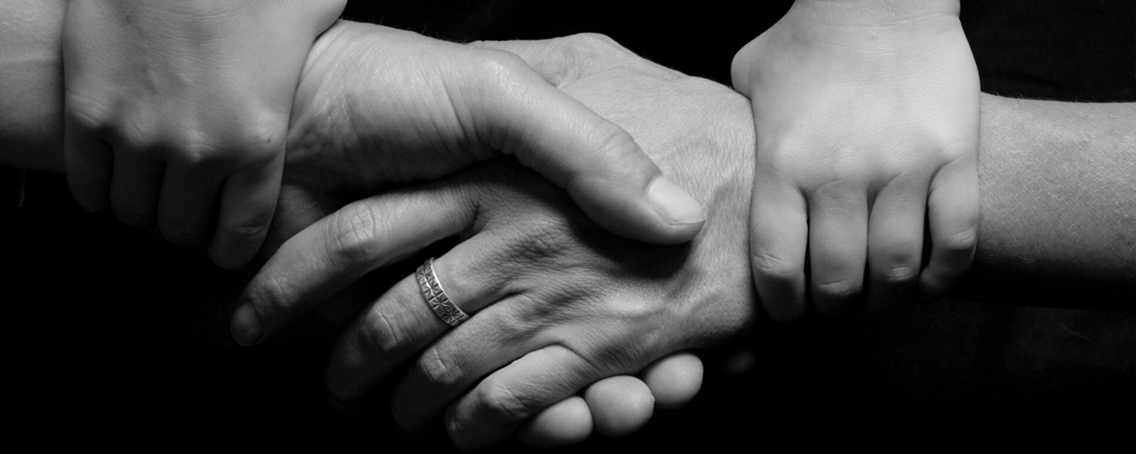 Grandmother holding grandchild's hand