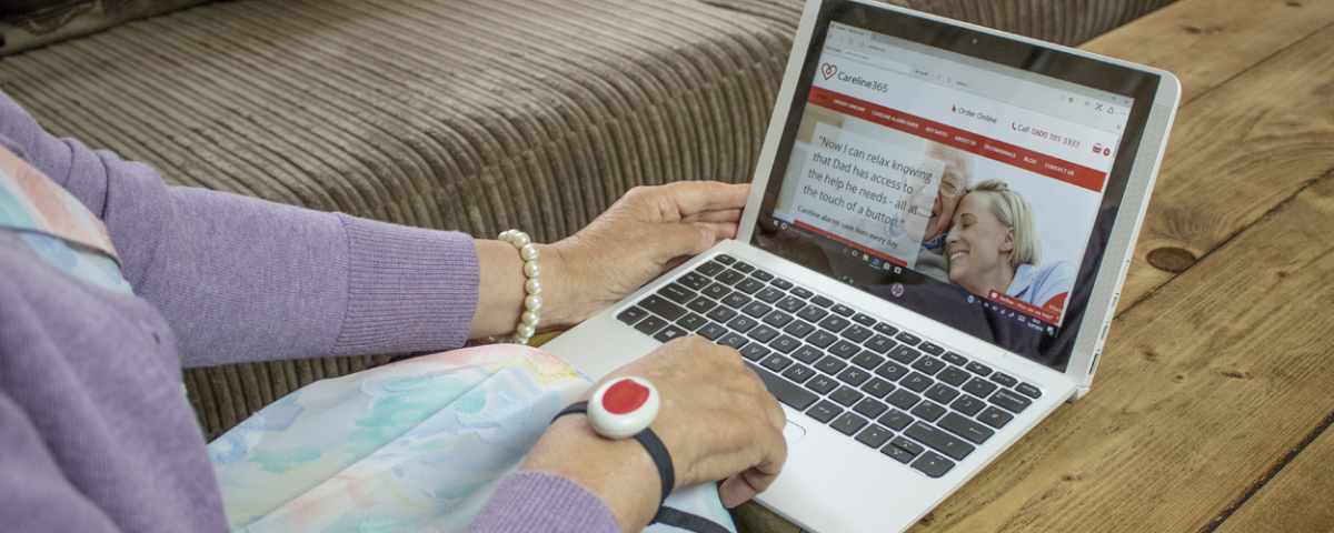 Elderly lady on her laptop looking at the Careline website