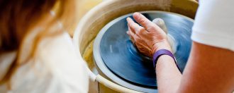 Lady sculpting pottery