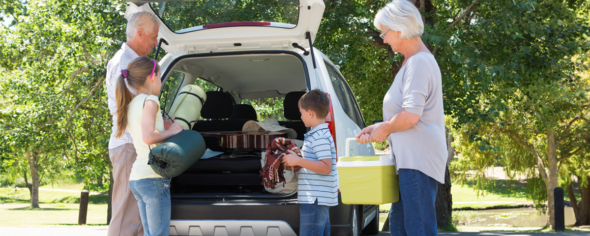 Elderly grandparents taking the grandchildren out