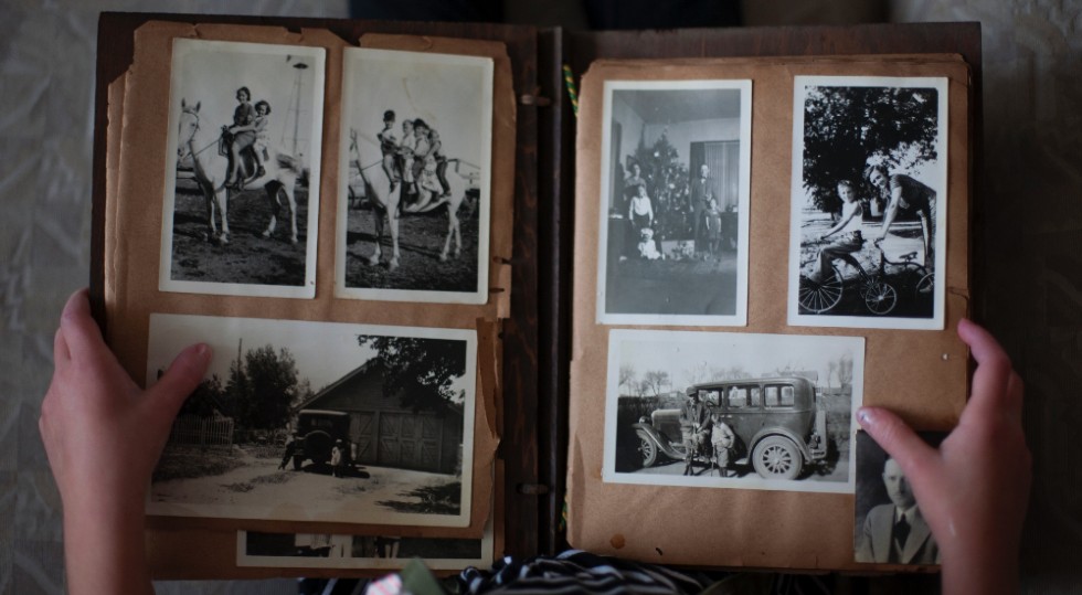 New year's resolution person holding family photo album