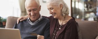 Elderly couple on a laptop