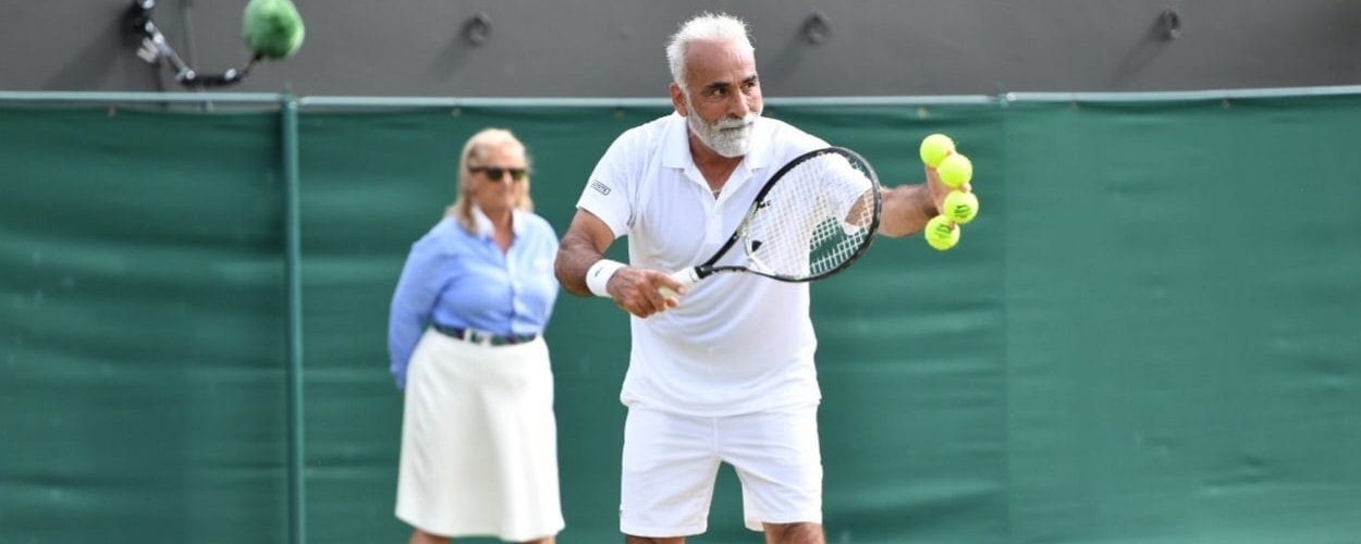 Elderly man playing tennis