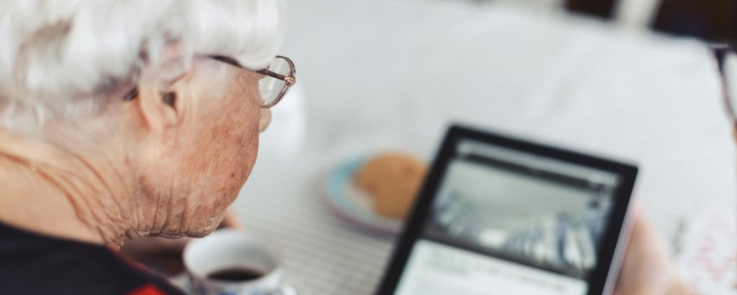 Elderly Woman Using Tablet During National Lockdown