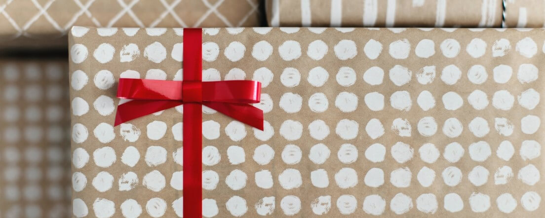 Present wrapped with a red bow