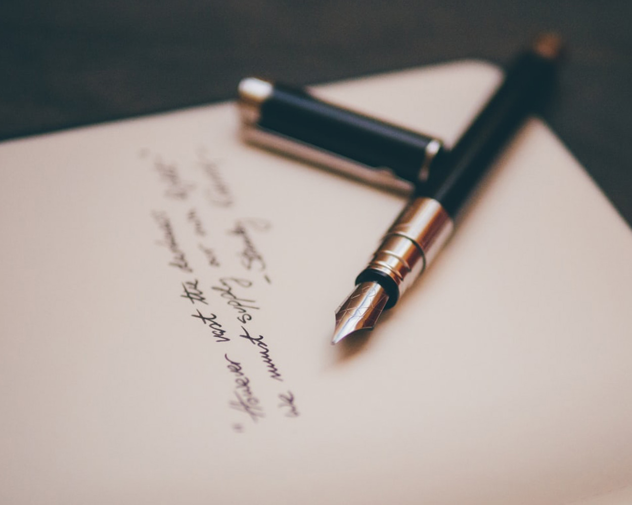 pen sitting on top of a legal document used by the legal executor