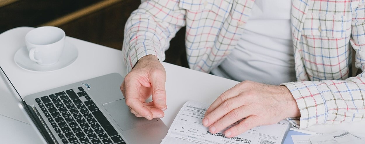 elderly man filing digital legacy paperwork