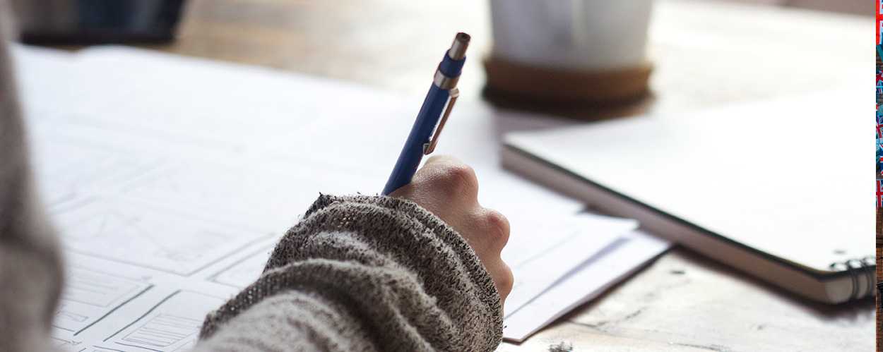 person filling in residential care paperwork